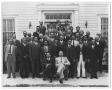 Photograph: [Group of Hispanic Men in Front of a White Building]