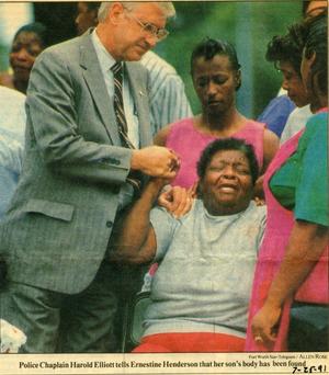 Primary view of [Arlington Police Chaplain Harold Elliott comforting Ernestine Henderson, newspaper clipping, 1991]