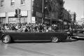Photograph: [The presidential limousine turning onto main street in downtown Dall…