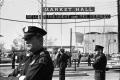 Photograph: [Dallas Police officers standing guard outside the Dallas Trade Mart]