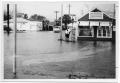 Photograph: [Flooding Outside Barber Shop]