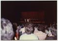 Photograph: [Audience watching people on stage at Coliseum]