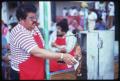 Photograph: [Participant Slicing Meat at the Texas Folklife Festival]