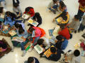 Photograph: [Students read books together at Seminary Hills Elementary]