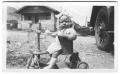 Photograph: [Ada Francis Brake on tricycle]