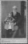 Photograph: [Man with long, white beard holding child]