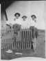 Photograph: [Sam, Otis, and Barney Mundy on Fence]