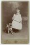 Photograph: [Baby and Dog Statue]