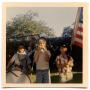 Photograph: Three boys in a Fourth of July parade