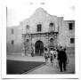 Photograph: People walking outside The Alamo