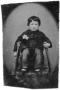 Image: [Child Sitting in a Chair]