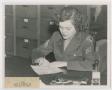Photograph: [Woman Writing at Desk]
