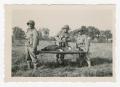 Photograph: [Soldiers Bearing a Man on a Litter]