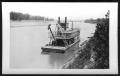 Photograph: [A Boat Close to River Bank. Location Unknown.]