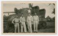 Photograph: [Four Soldiers and their Tank called "Grim Reaper"]