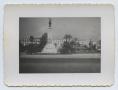 Photograph: [Monument by Building]