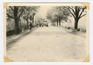 Primary view of [U.S. Soldiers and Vehicle on the Road to Binswangen, Germany]