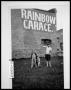 Photograph: Children and Dog in Front of the Rainbow Garage