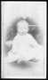 Photograph: [An infant in a white dress. Infant has bare feet.]