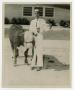 Photograph: [Boy with a Cow]
