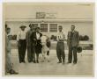 Photograph: [People and a Cow at the Food and Livestock Show]