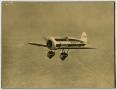 Photograph: [Photograph of a Plane in Flight]