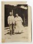 Photograph: [Abner and Sarah Davis Standing by a House]