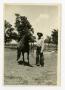 Photograph: [Eli Pruitt with a Horse]