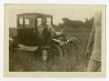 Photograph: [Man in a Bathing Suit Standing by a Car]