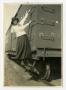 Photograph: [Girl Holding onto Side of Boxcar]