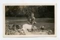 Photograph: [Photograph of Soldier Washing Clothes]