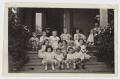 Photograph: [Children Sitting on Front Steps of a Building]