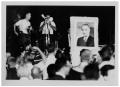Photograph: [Photographers and a Picture of Lyndon Johnson]
