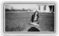 Photograph: [Dorothy Katt Sitting on Lawn]