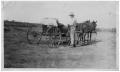 Photograph: [Man Standing by a Horse-Drawn Wagon]