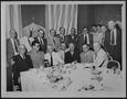 Photograph: [Group of men dining at a Houston hotel]
