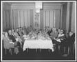 Photograph: [Albert Peyton George and a group of men in the dining room of a Hous…