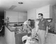 Photograph: [Family in Kitchen of Watt Watkins Residence]
