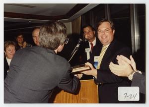 [Photograph of Tieman H. Dippel, Jr. with Award]