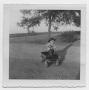 Photograph: [Photograph of Robert Lee Daniel in Little Wagon]