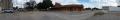Photograph: Panoramic image of the parking lot across from the train depot in Gai…