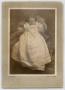 Photograph: [Photograph of an Infant in a Large Dress]
