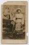 Postcard: [Postcard Picturing an African-American Girl Next to an Artificial Ho…