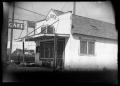 Photograph: [Photograph of a Cafe and an Automobile]