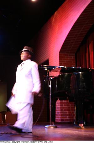 Primary view of [Boy in white suit on stage]