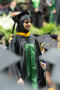 Photograph: [Graduate Student Walking with her Diploma]