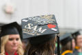 Thumbnail image of item number 1 in: '[Journalism Master's Graduate wearing decorated cap]'.