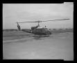 Photograph: [Photograph of a UH-1F Iroquois helicopter parked on a concrete surfa…