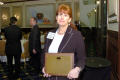 Photograph: [Wanda Cash holding up her "Bright Idea" award]