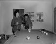 Photograph: [Bill Mack and his wife playing pool]